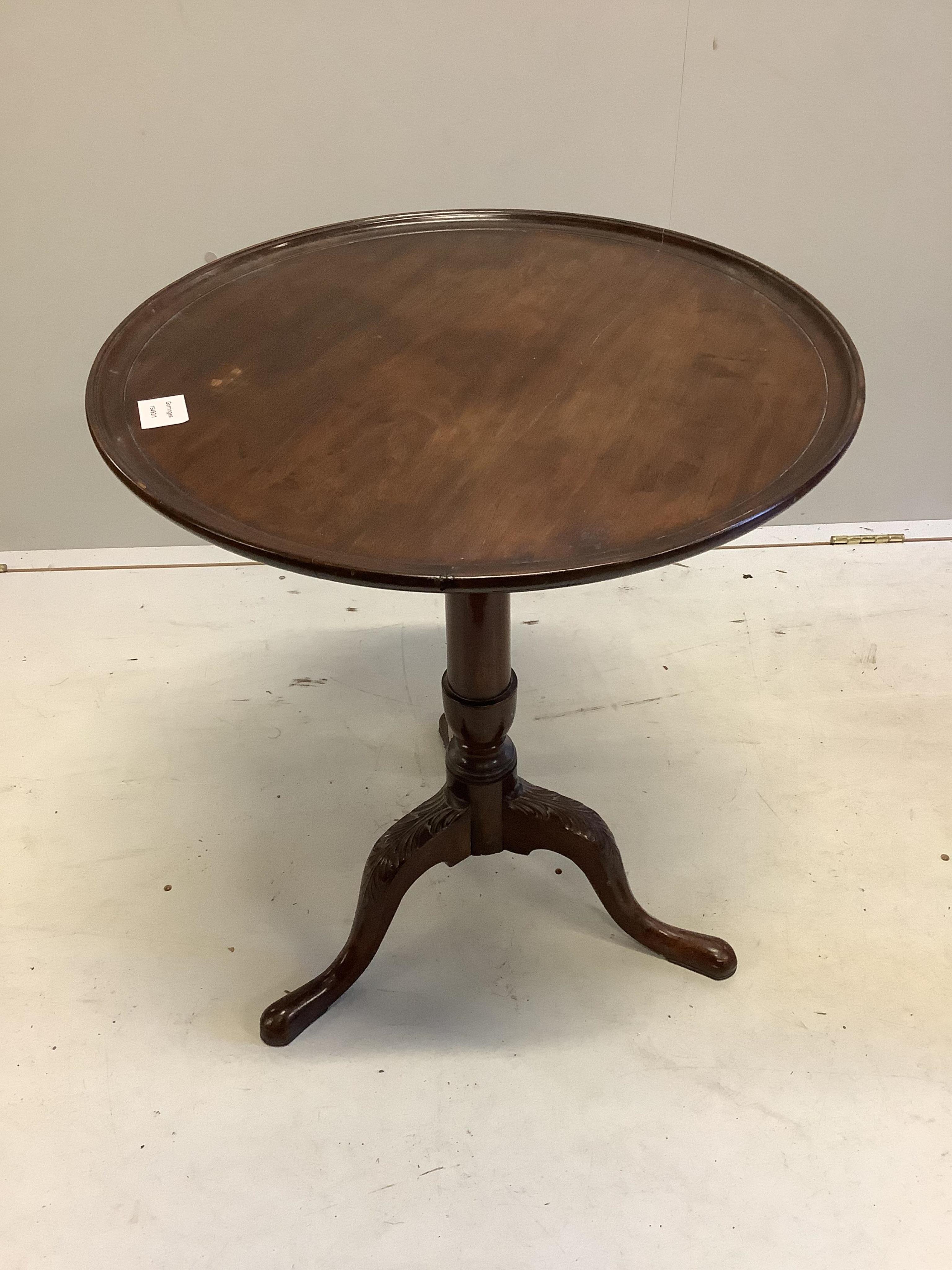 An Edwardian George III style circular mahogany tilt top wine table, on carved cabriole legs, diameter 56cm, height 65cm. Condition - fair